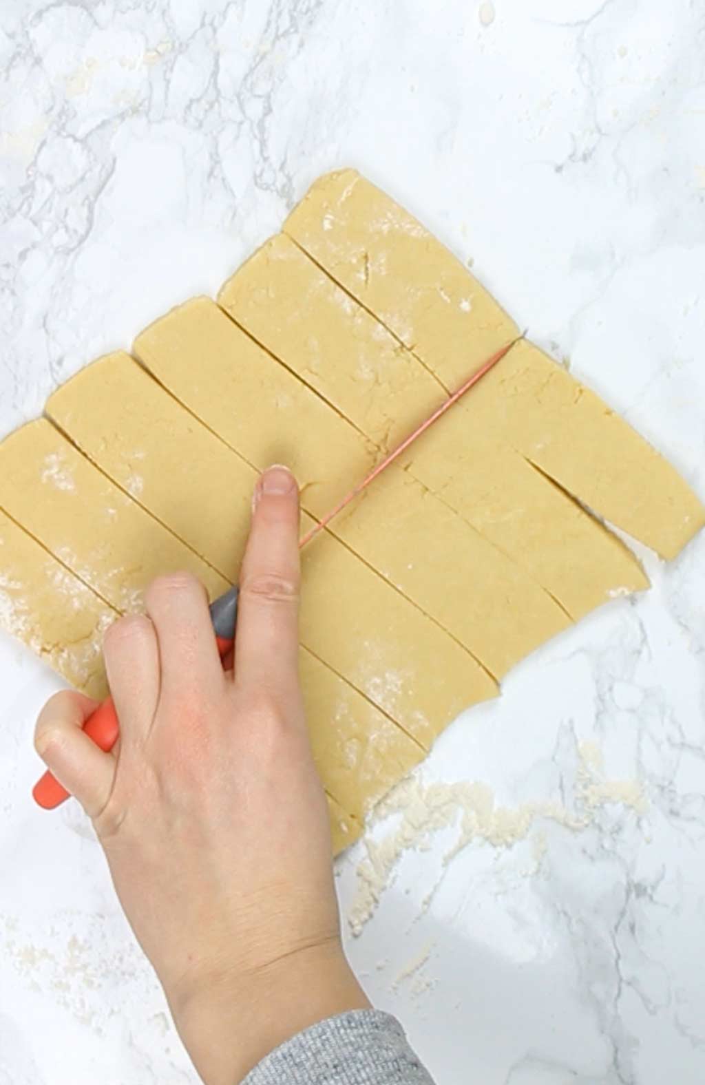 cutting dough into fingers