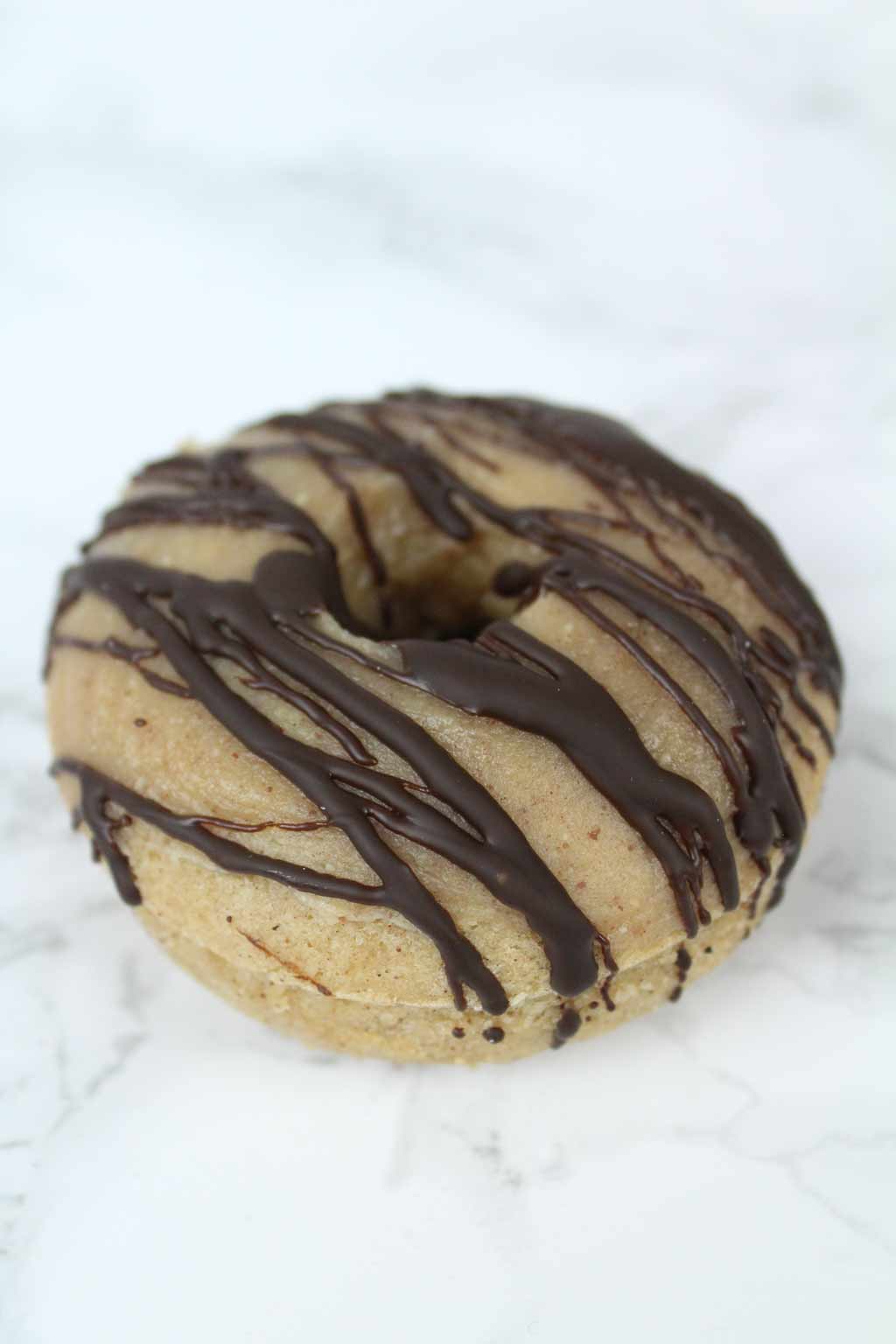 vegan peanut butter donut with chocolate on top