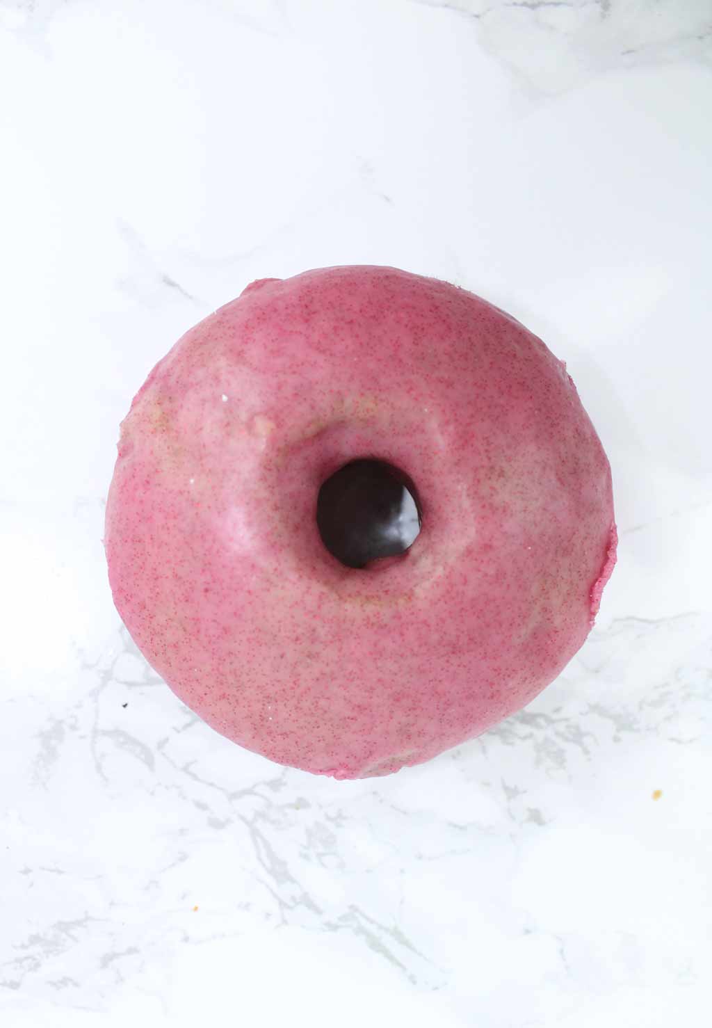 vegan raspberry glaze donut