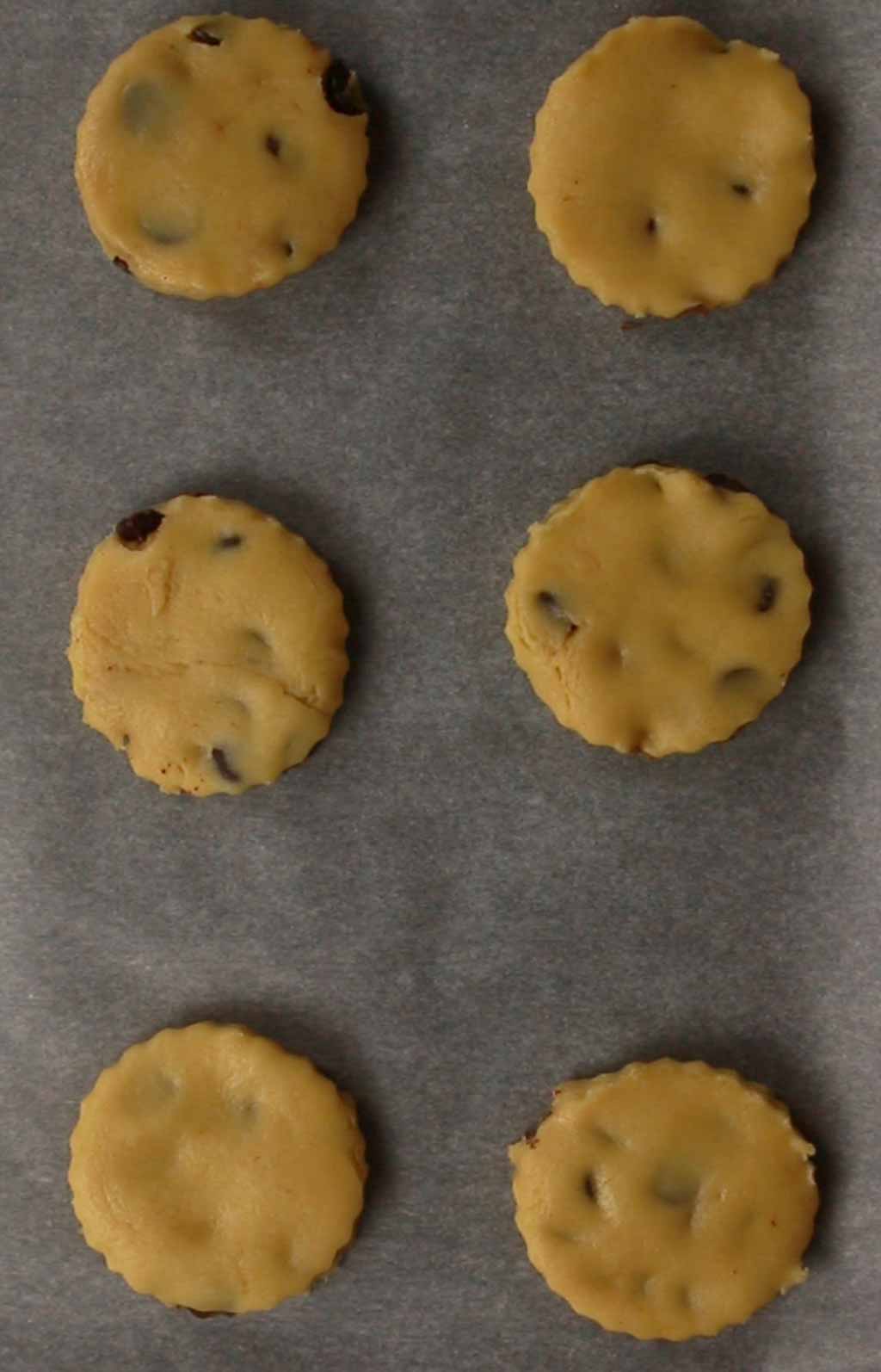 Unbaked Cookies On A Baking Sheet