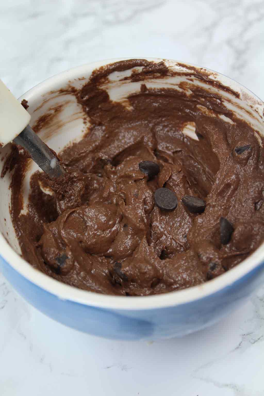 chocolate chips in brownie batter, in a bowl