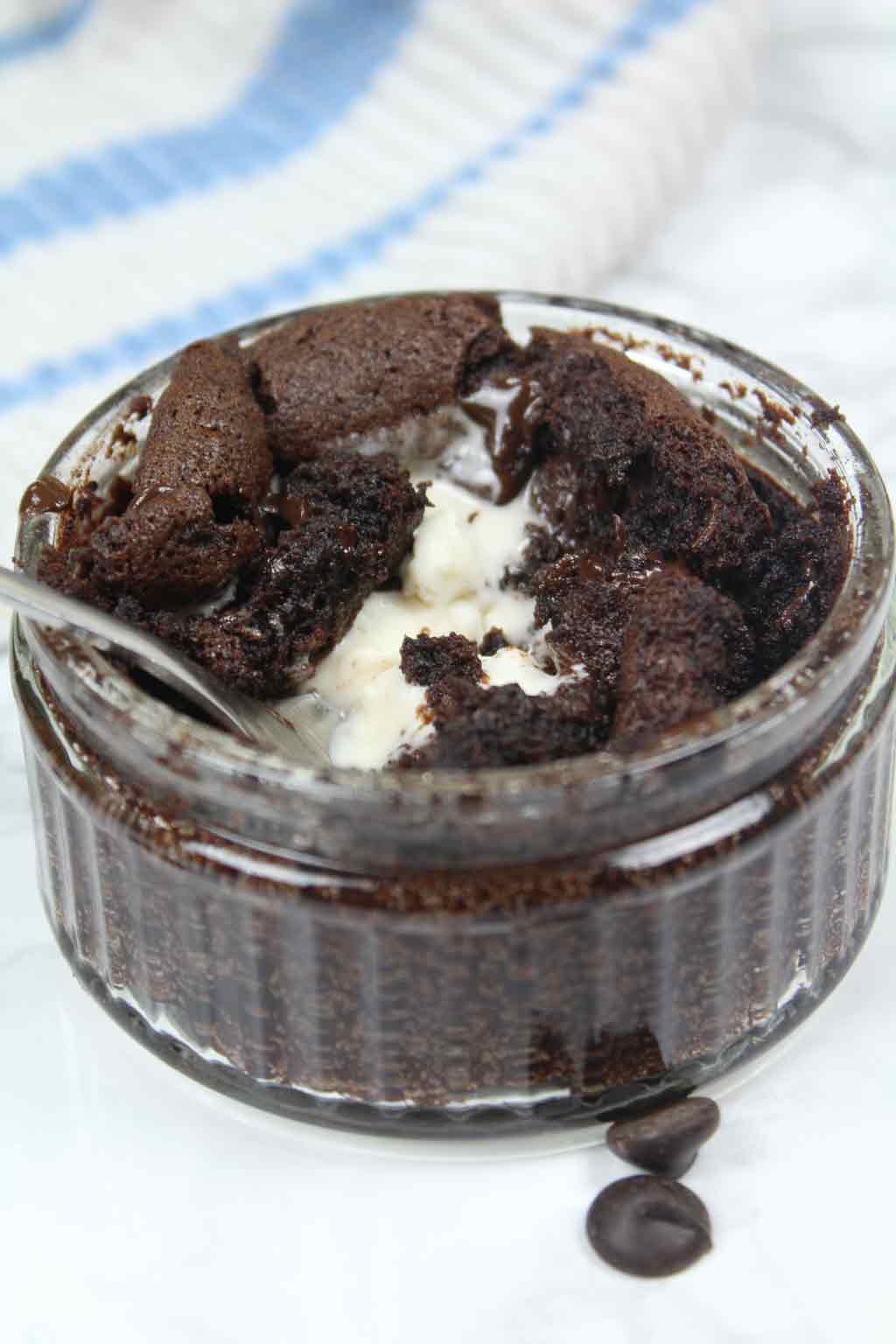 half eaten mug brownie with melted ice cream in the center