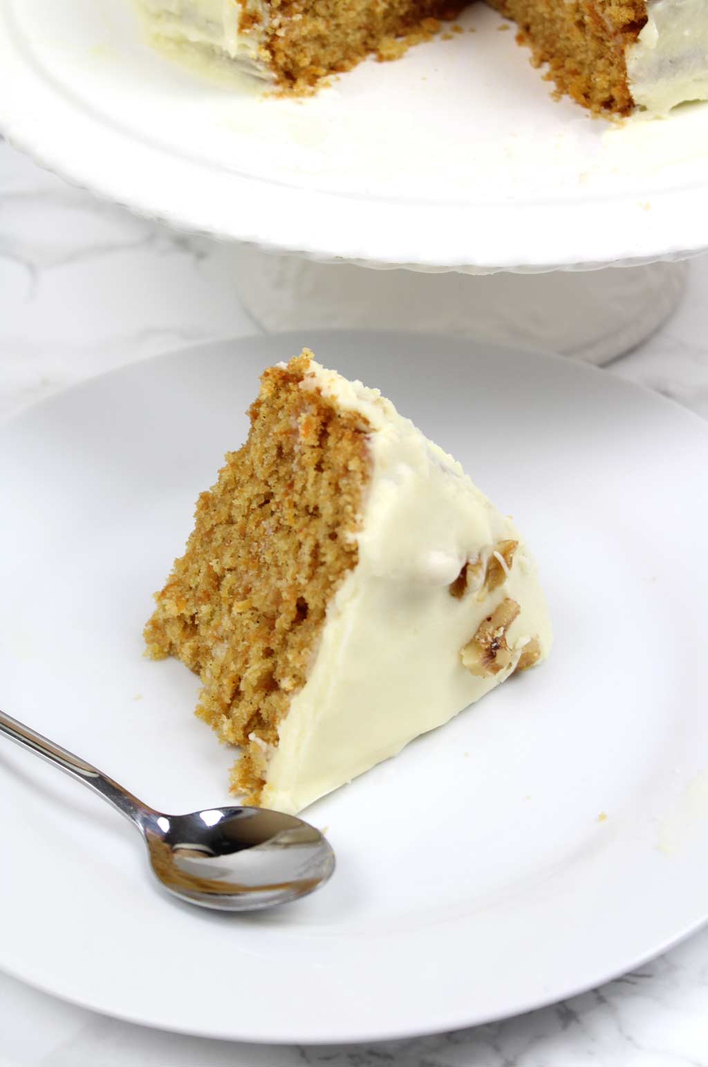 a slice of vegan carrot cake on a plate