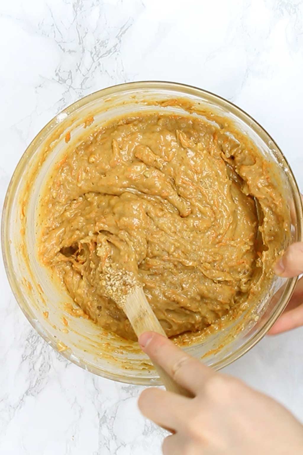 mixing walnuts into cake batter