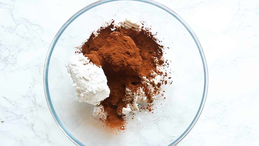 coconut cream, cocoa powder and liquid sweetener in a bowl ,