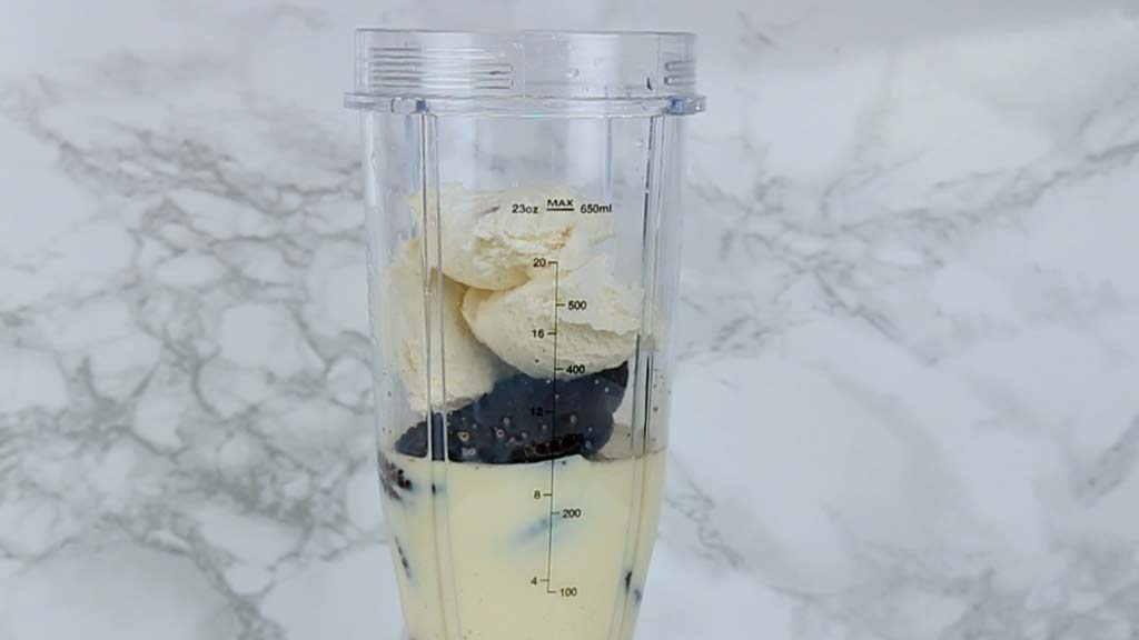 ice cream in the blender cup with the rest of ingredients