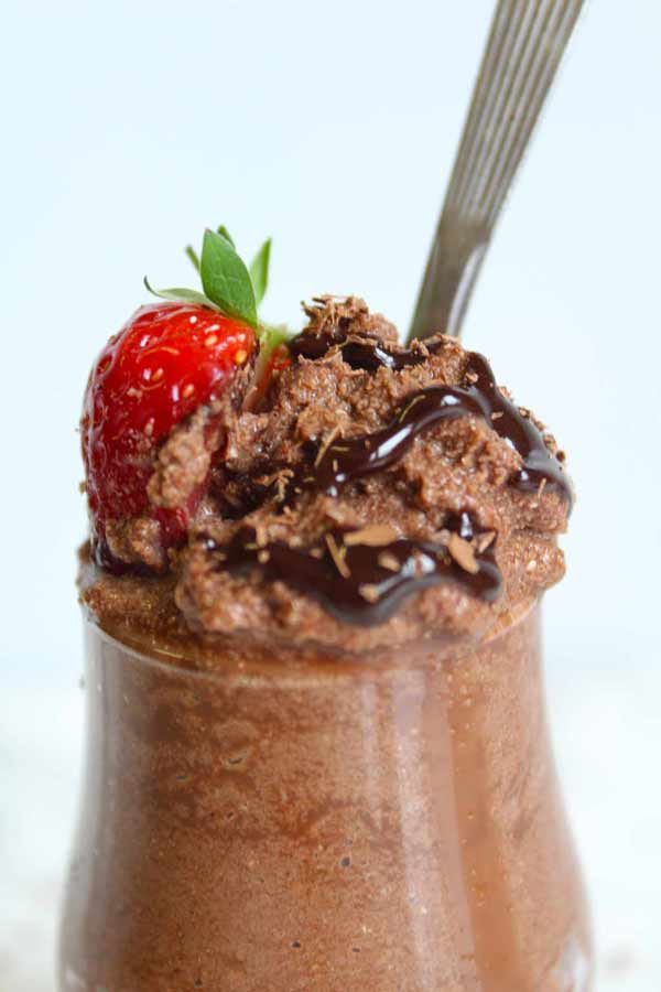 close up of chocolate mousse in a glass container