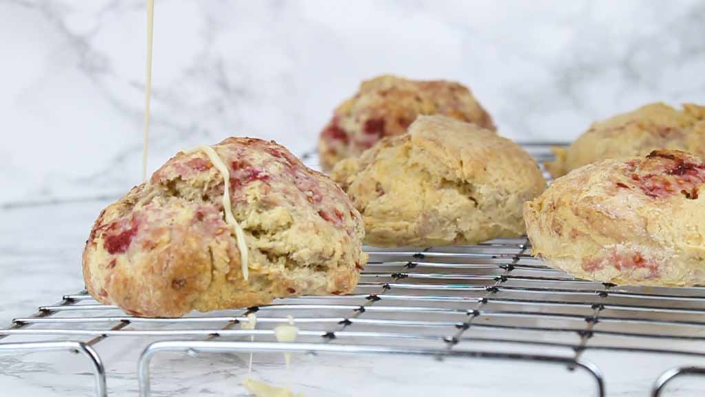 drizzling white chocolate over the baked scones