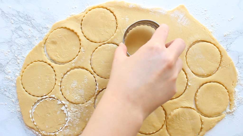 cutting cookie shapes out of the dough