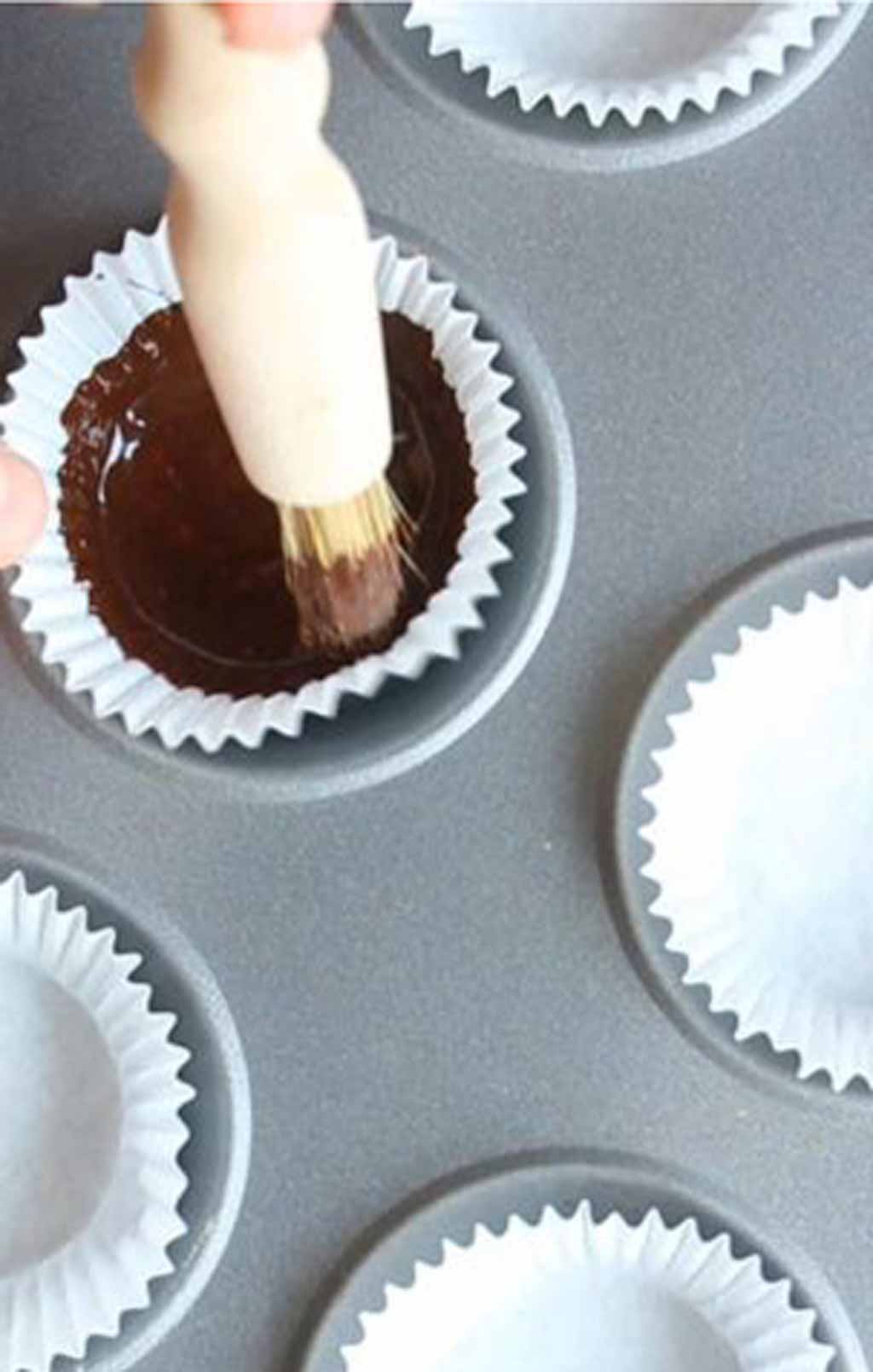 Painting Chocolate Onto The Paper Case With A Pastry Brush