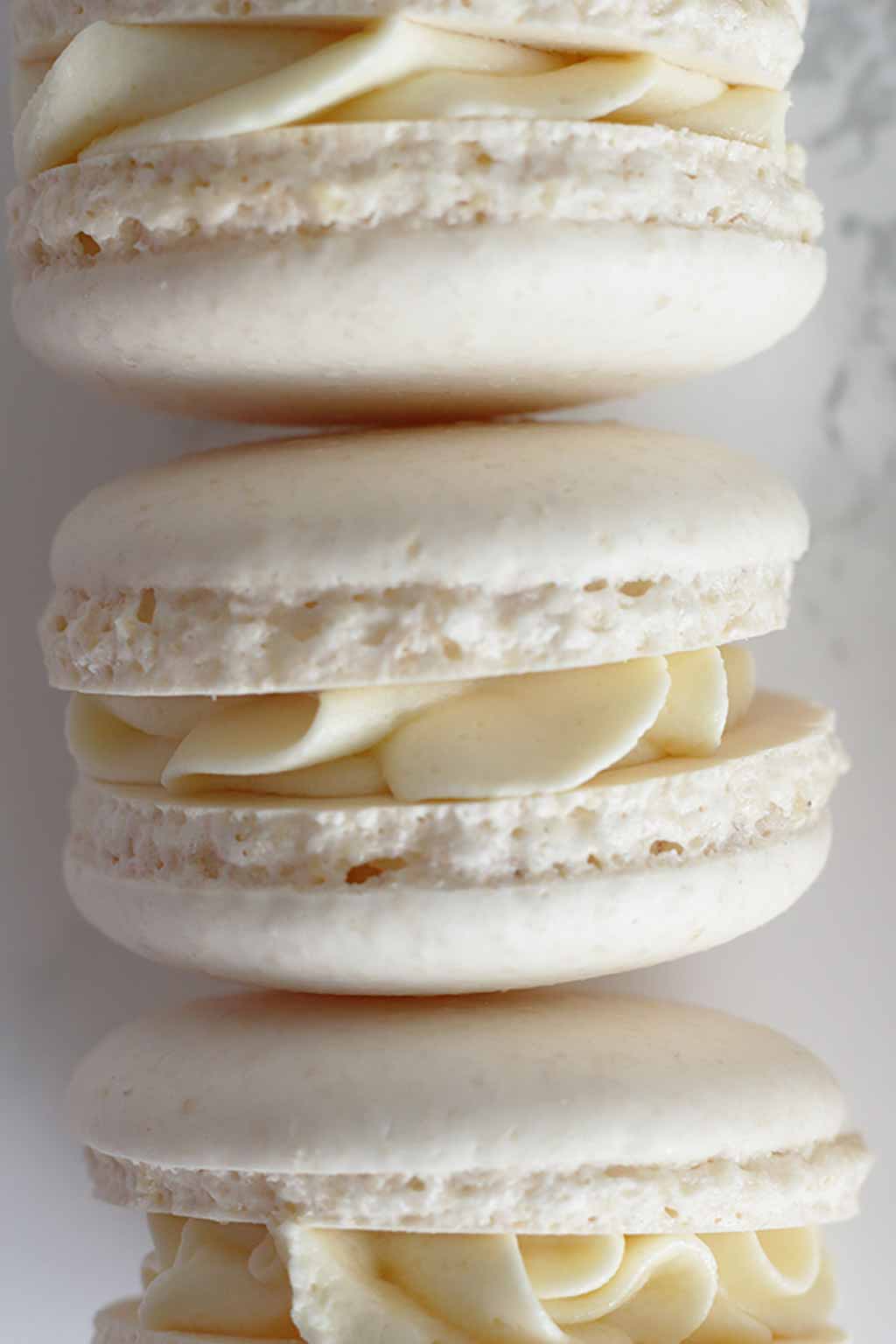 3 white Macarons on their side
