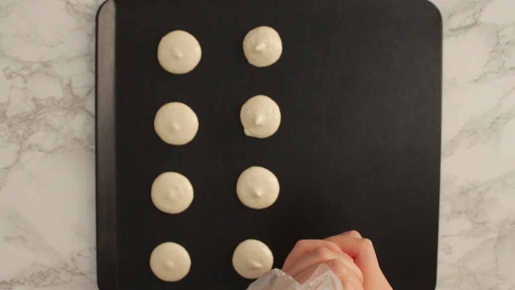 Piping Macarons Onto The Tray