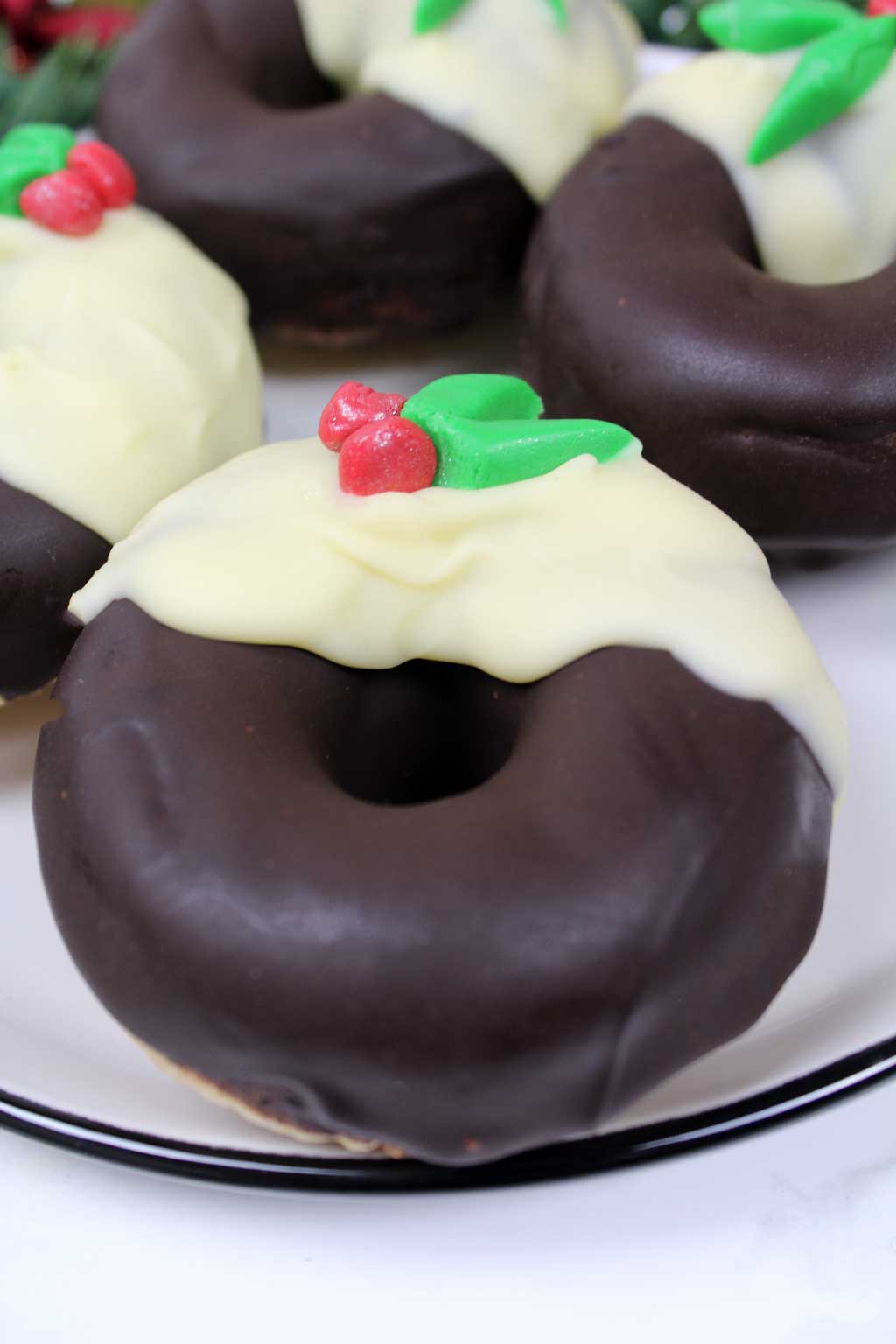 a Christmas pudding donut on a plate