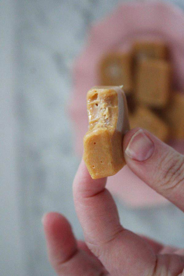 fingers holding up a piece of freezer fudge