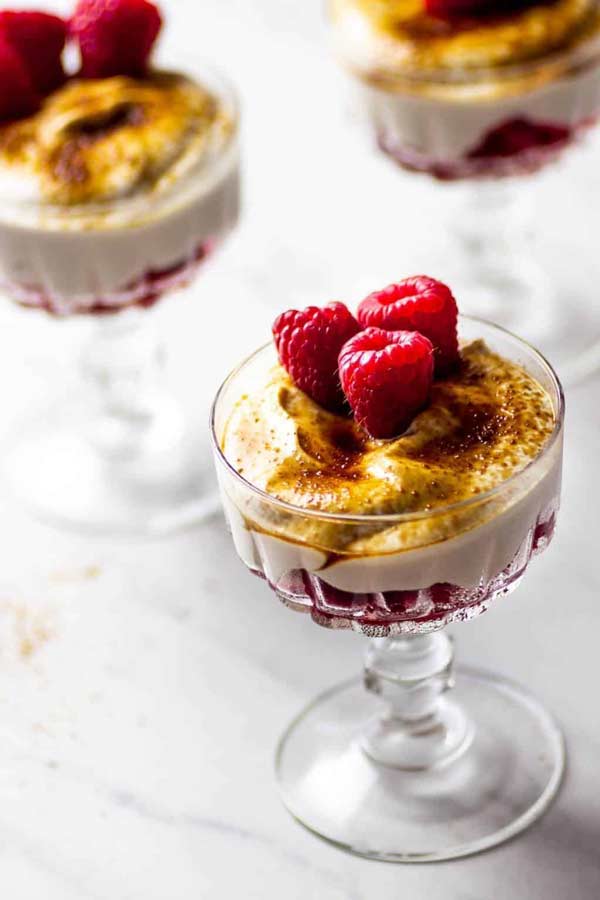 3 raspberry cream desserts in glass holders