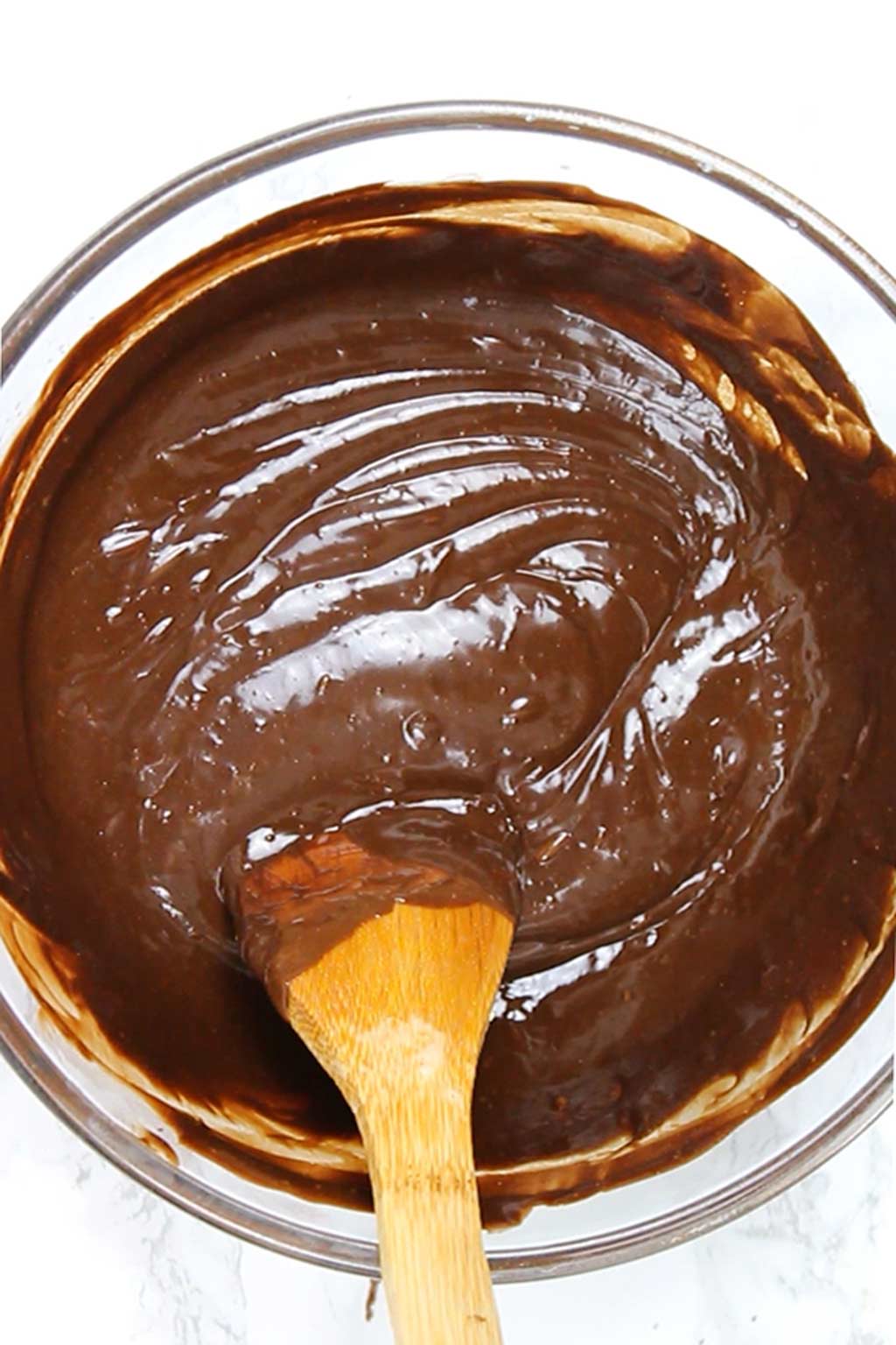 smooth and creamy chocolate frosting in a bowl