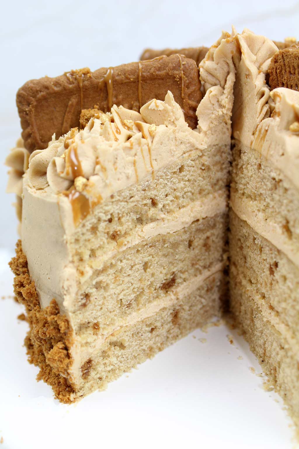 Biscoff cake with a slice taken out of the middle