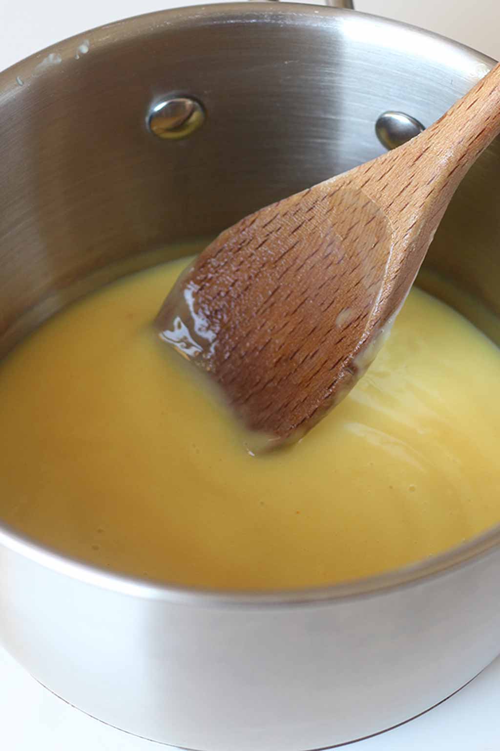 Custard In A Pot with wooden spoon