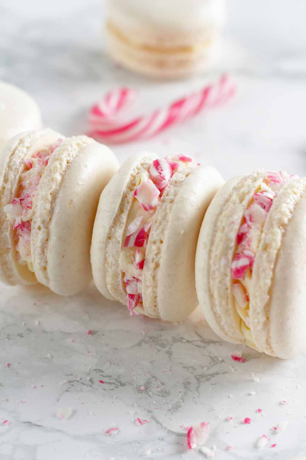 3 candy cane Macarons Lying On Their Sides