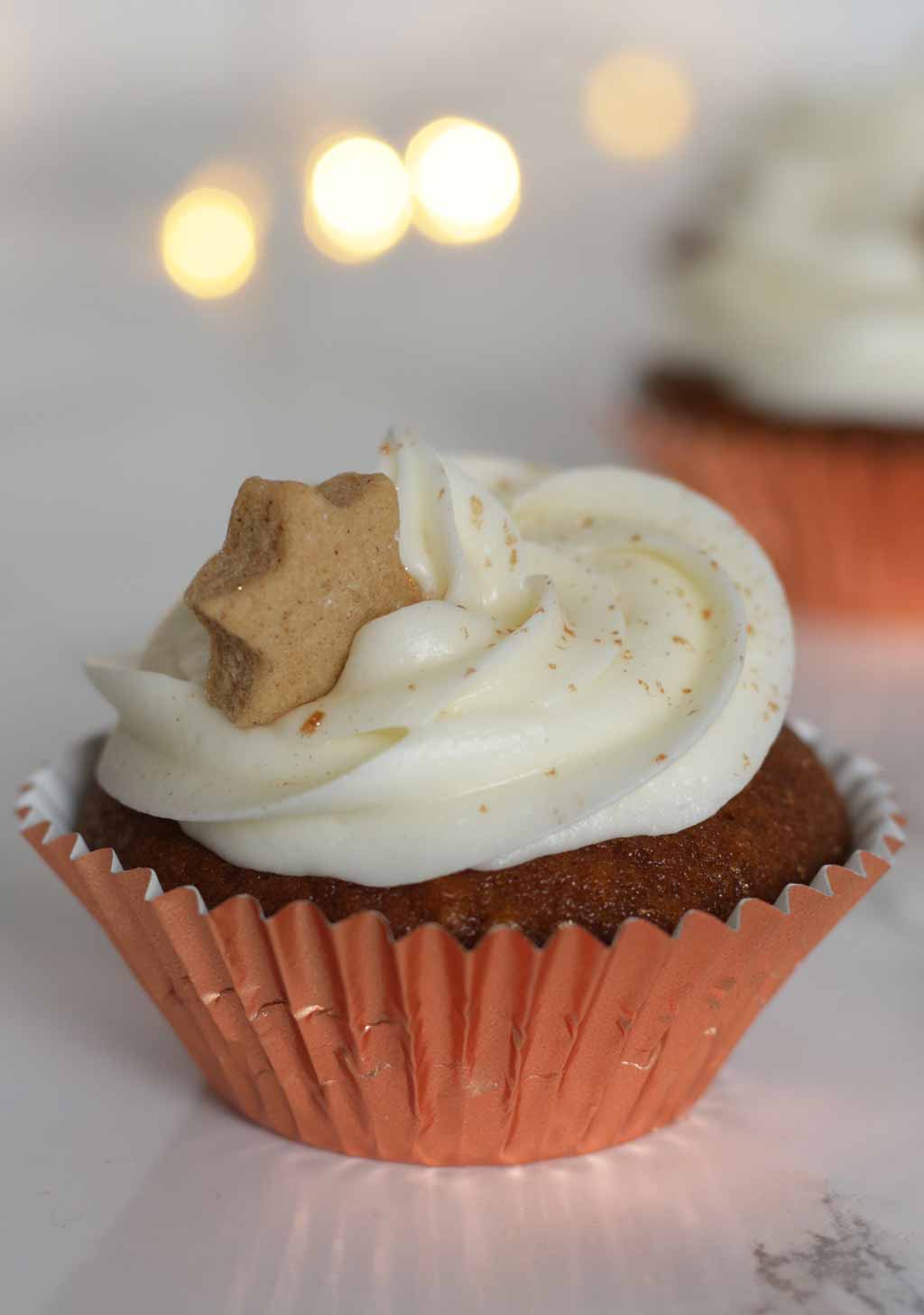 Gingerbread Cupcake In A Rose Gold Foil Case With Cream Cheese Icing And A Small Gingerbread Star On Top