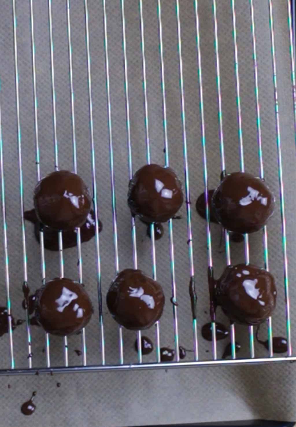 Chocolate Coated Truffles Resting On A Wire Rack