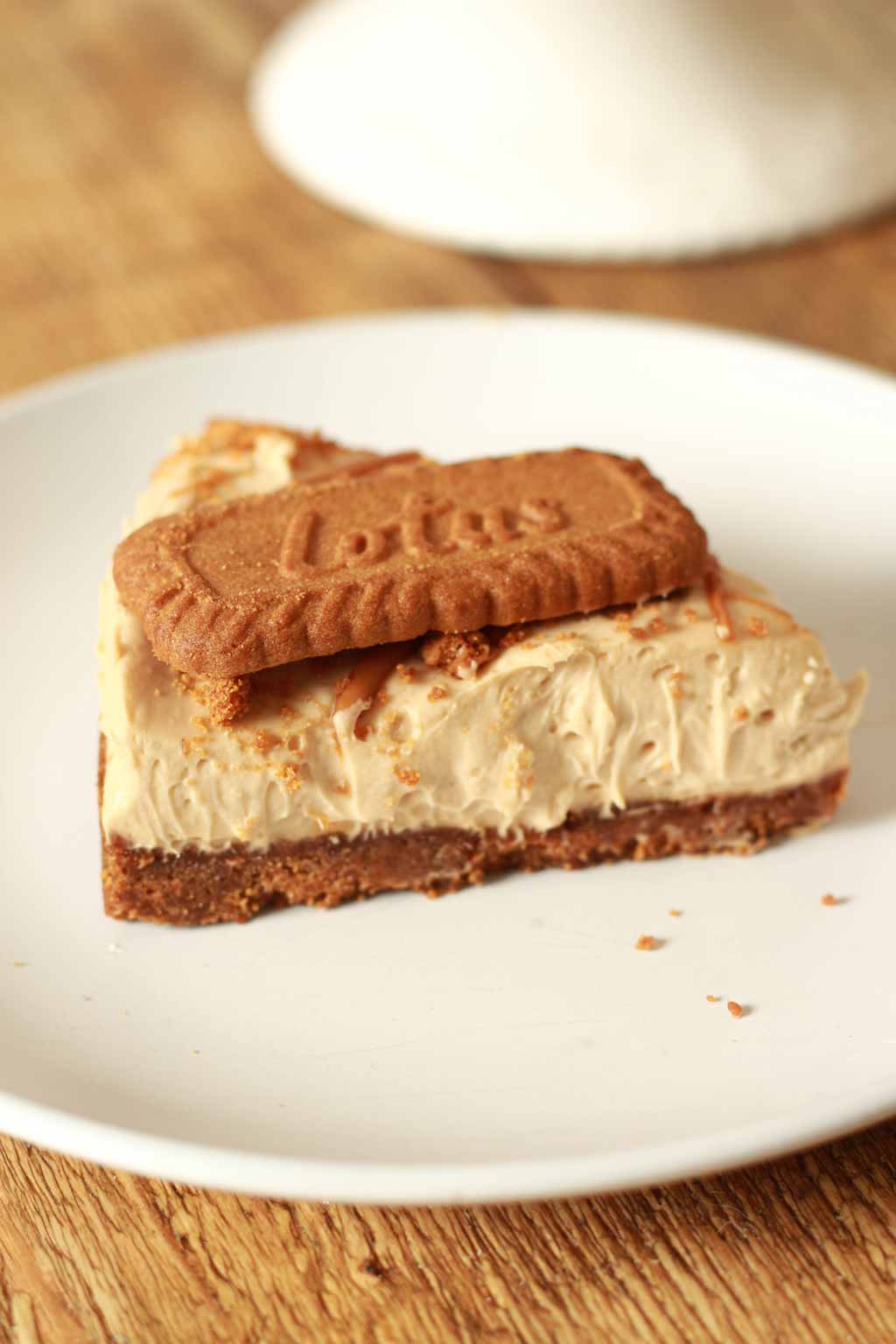 Slice Of Vegan Cheesecake With A Biscoff Biscuit On Top