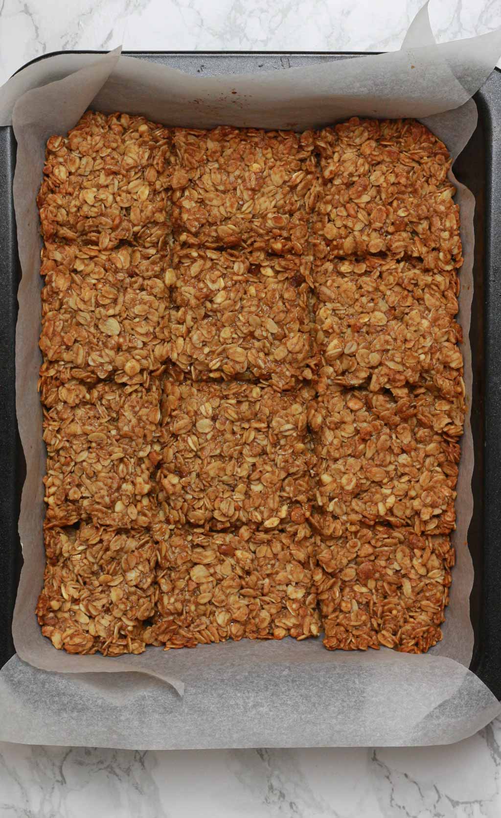 Baked Flapjacks With Score Lines In Them While Still In The Tin