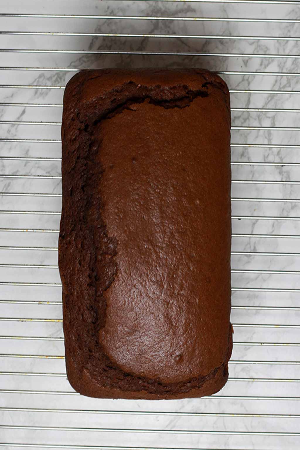 Chocolate Loaf Cooling On A Wire Rack