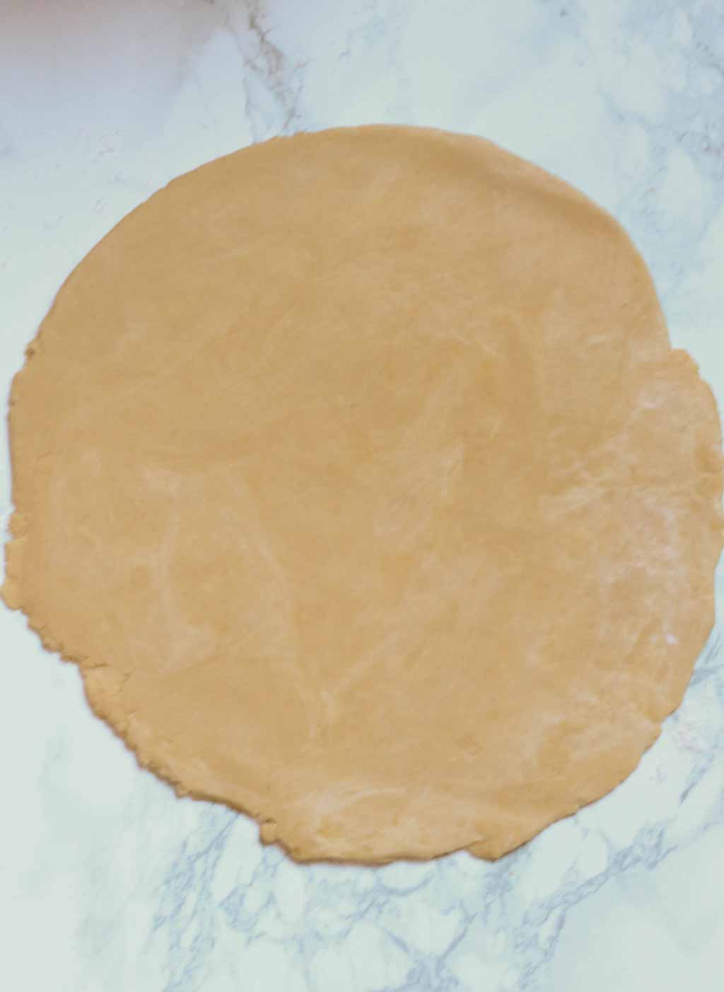 Shortcrust Dough Rolled Out On A White Surface
