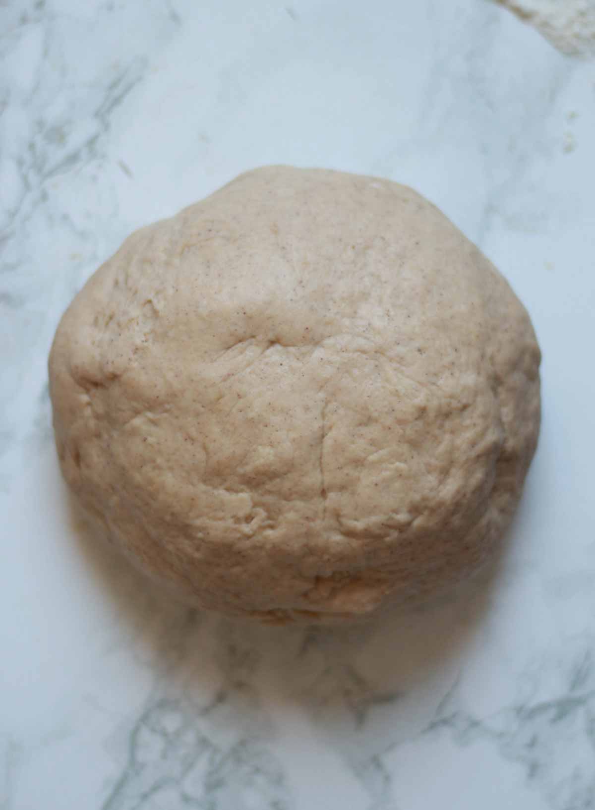 Ball Of Soft Dough On A White Surface