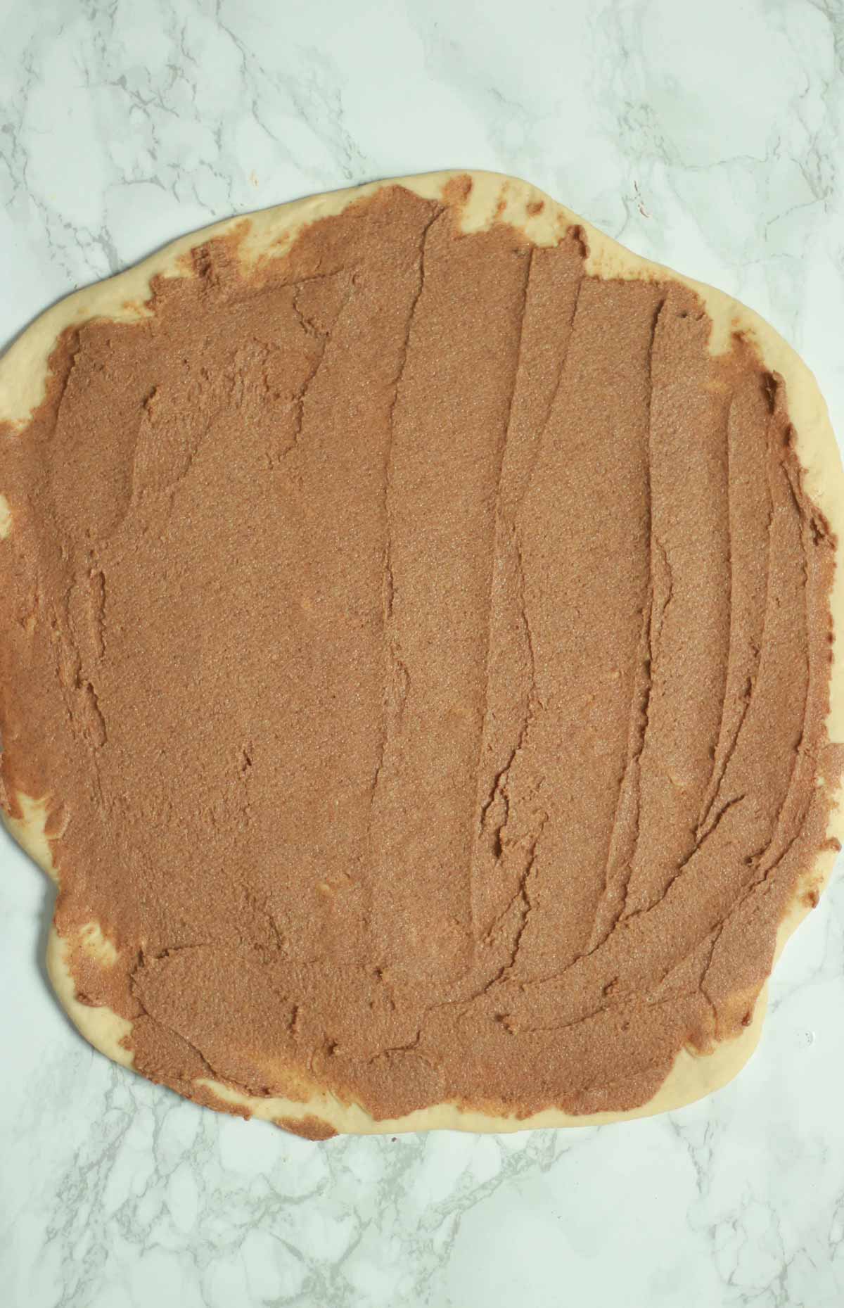 Dough Covered With Cinnamon Filling