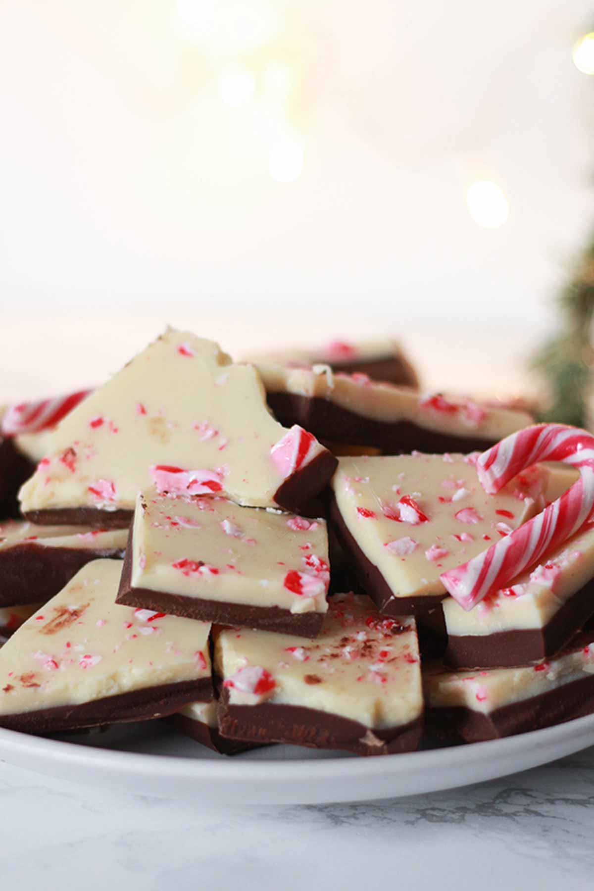 Plate Full Of Dairy-free peppermint Bark With Some Miniature Candy Canes
