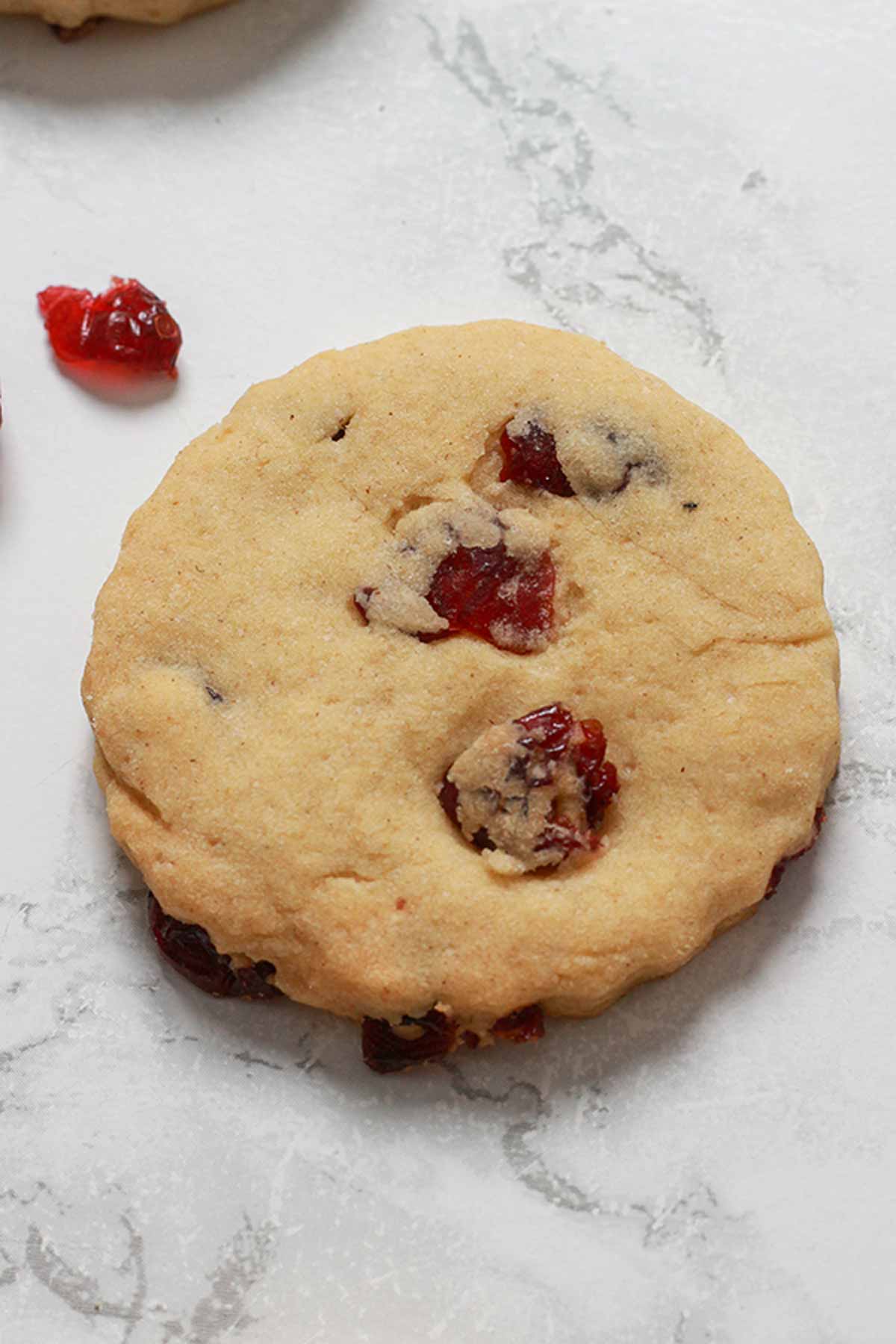 Overhead Shot Of Cranberry Shortbread Laying On White Surface