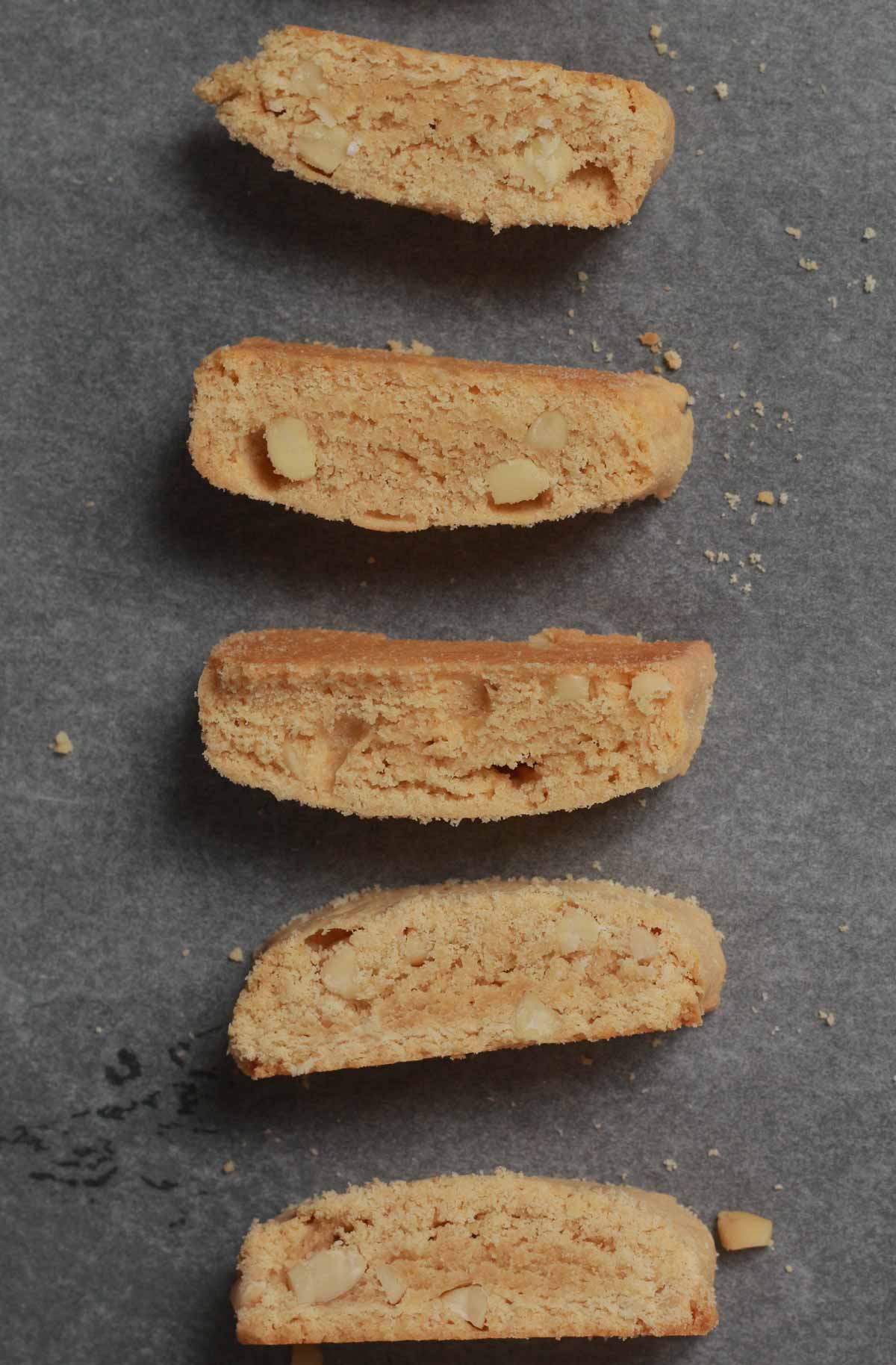 Slices Of Half Baked Biscotti On Baking Tray