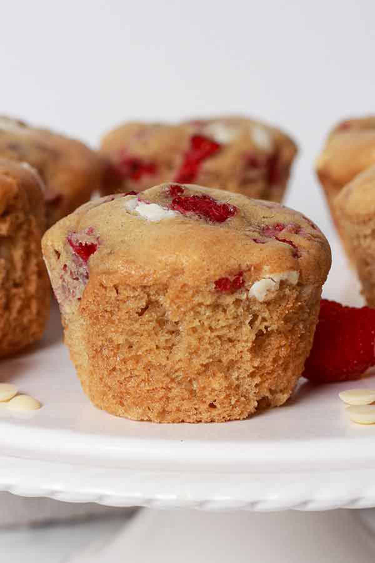Raspberry White Chocolate Muffins On A Cake Stand
