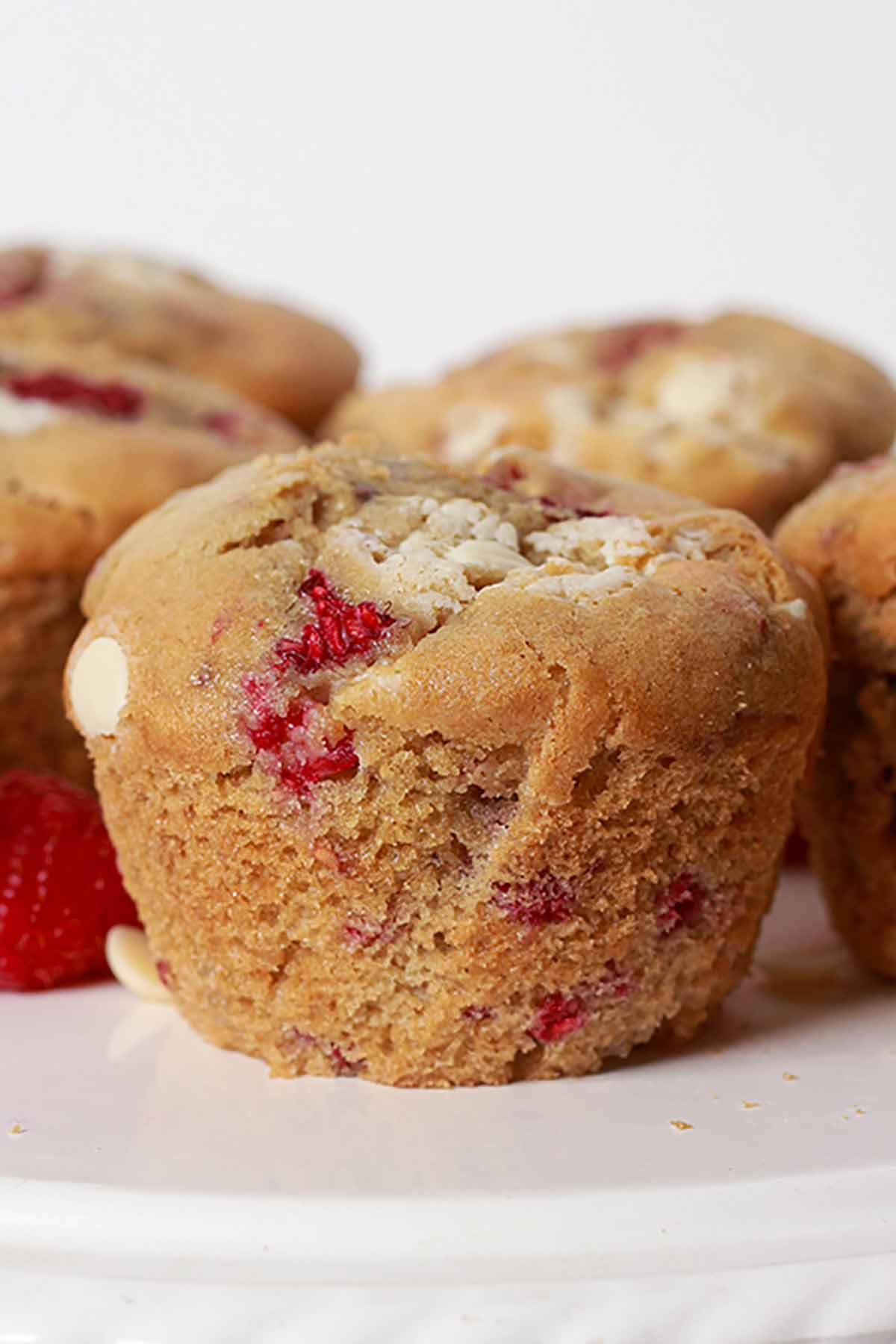 White Chocolate Raspberry Muffins On A Cake Stand