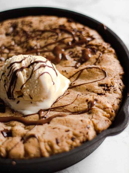 Thumbnail image- close up of cookie dough with ice cream and chocolate sauce on top