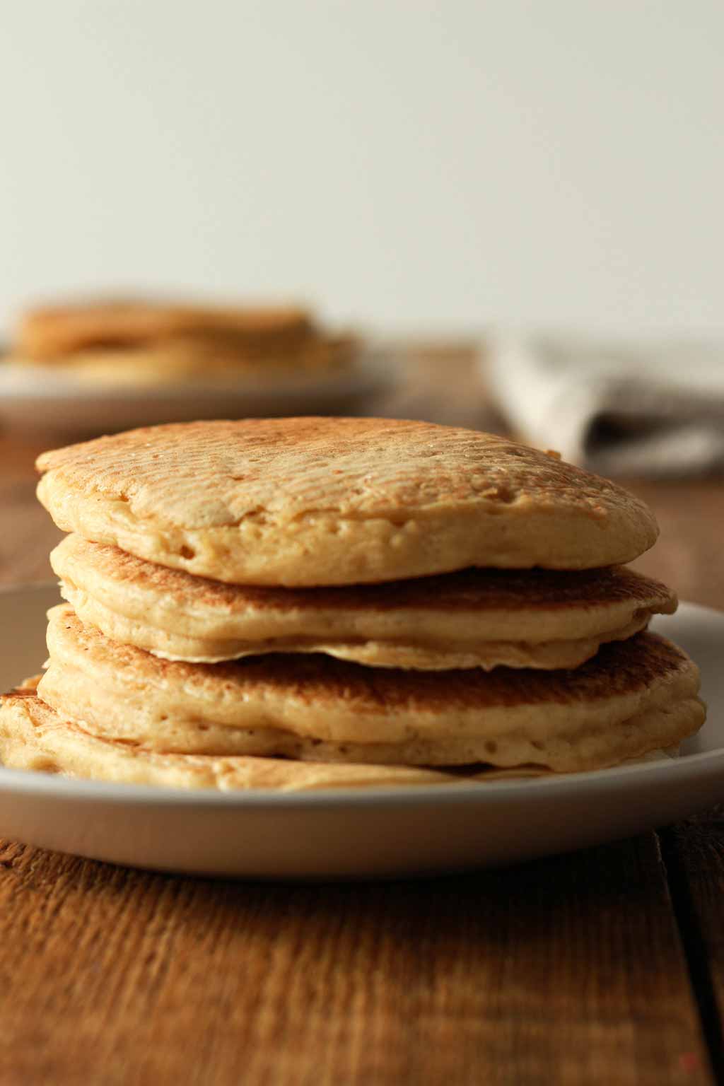 Stack Of 4 buttermilk Pancakes On A White Plate