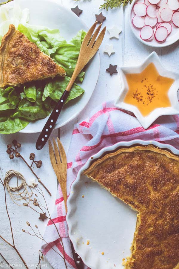 Overhead shot of quiche with slice cut out of it