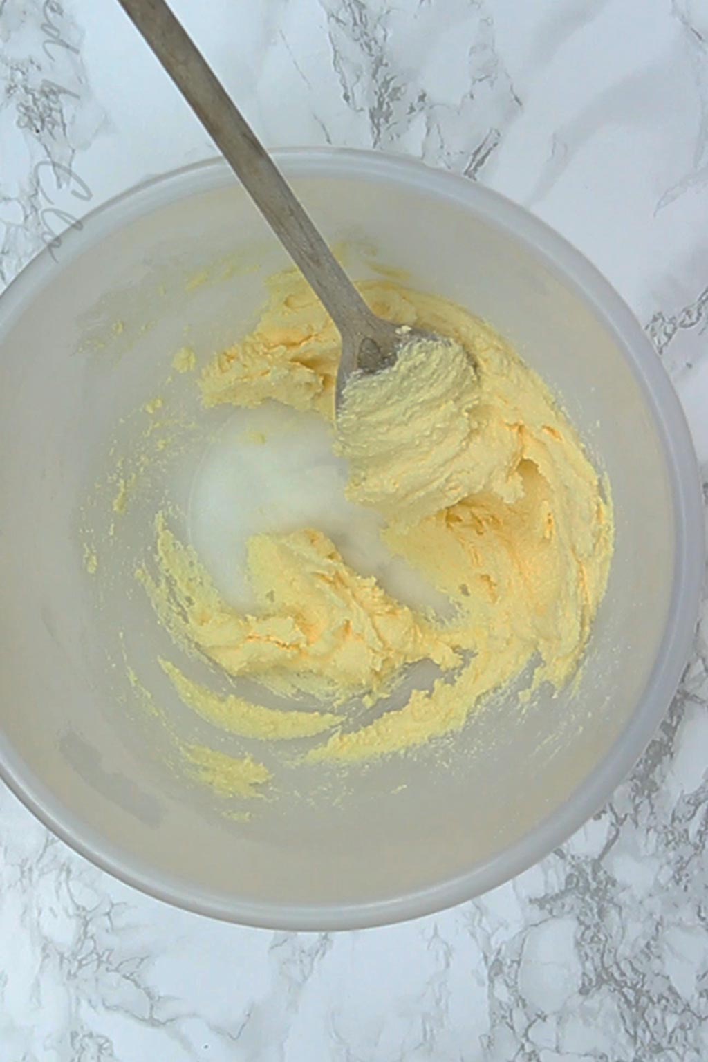 butter and sugar mixed together in a bowl