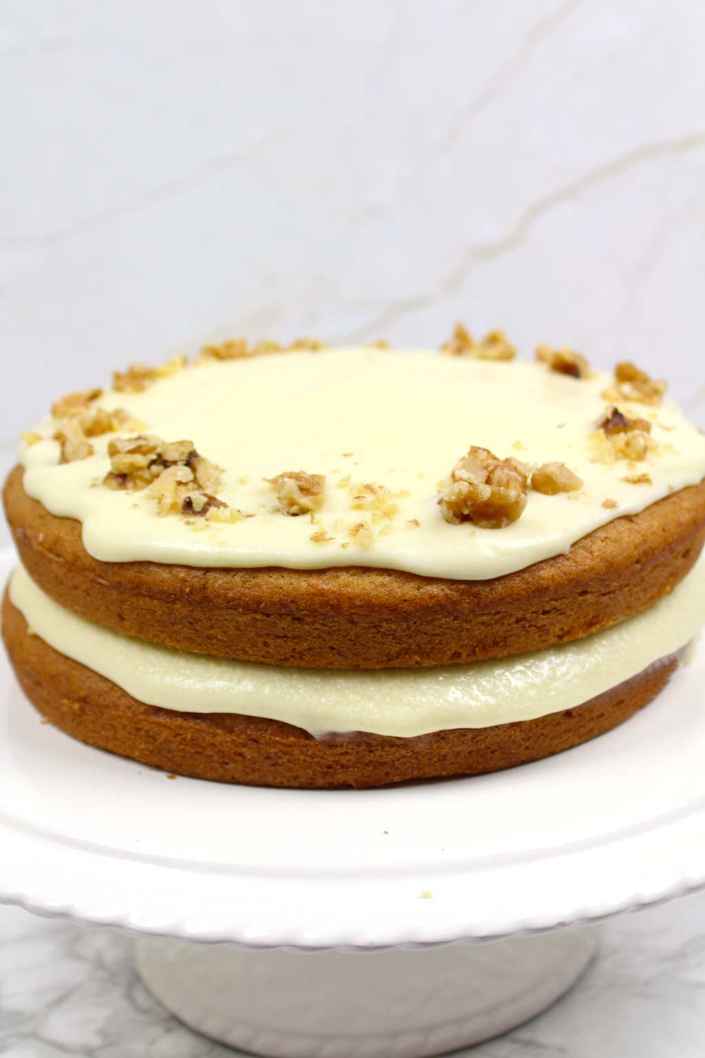 vegan carrot cake on a cake stand