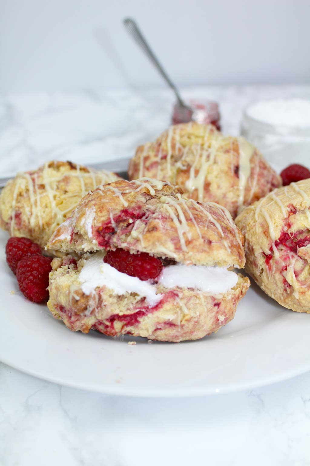 dairy-free scones on a plate filled with cream