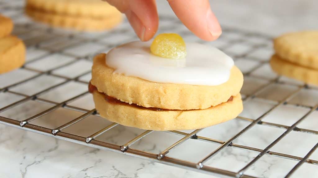 putting a Jelly Tot on top of the biscuits