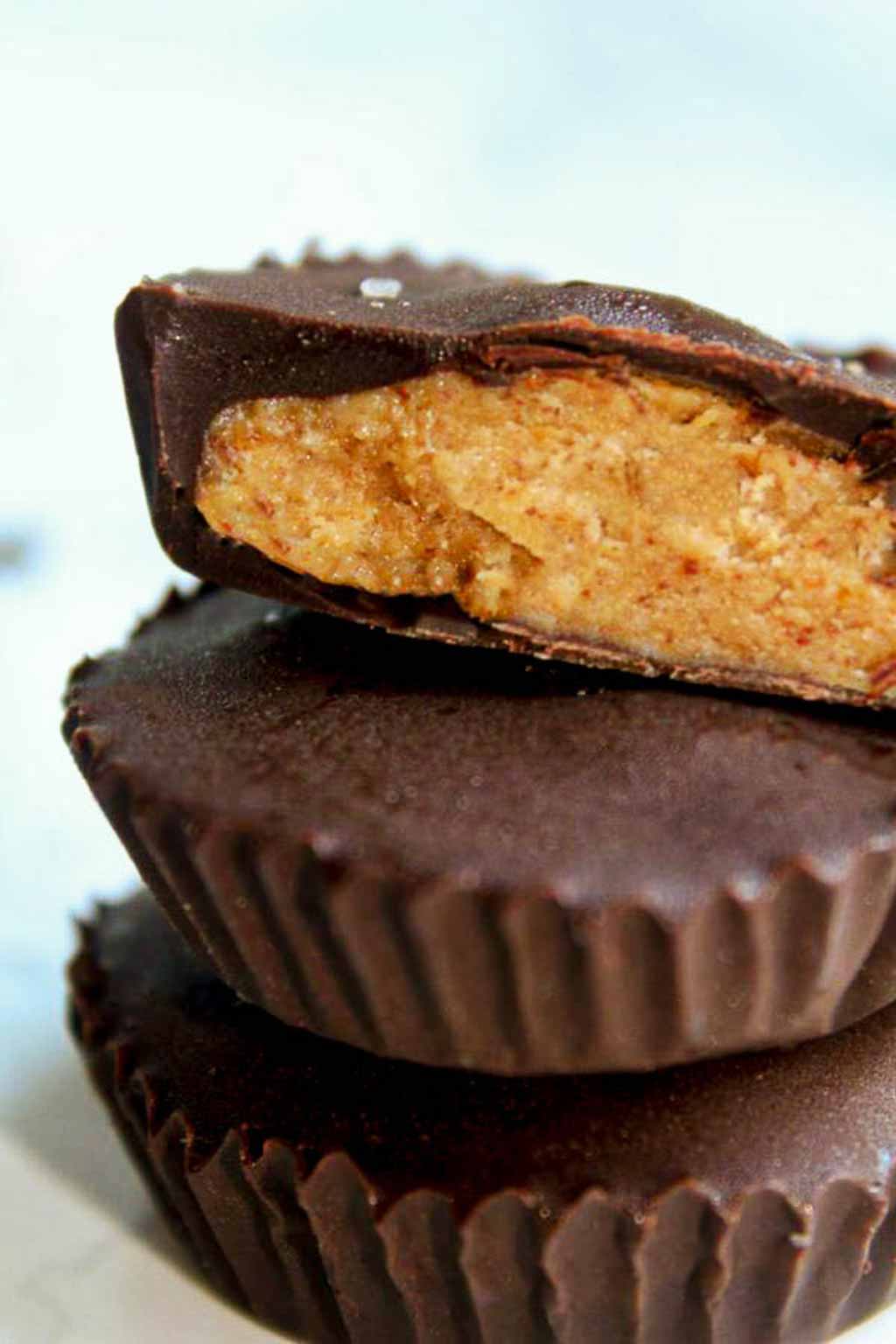 Stacked Peanut Butter Cups With The Top One Showing The Filling In The Middle