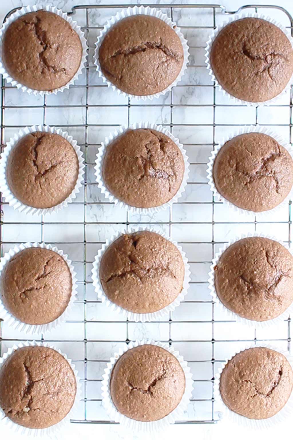 baked chocolate orange cupcakes cooling on a wire rack