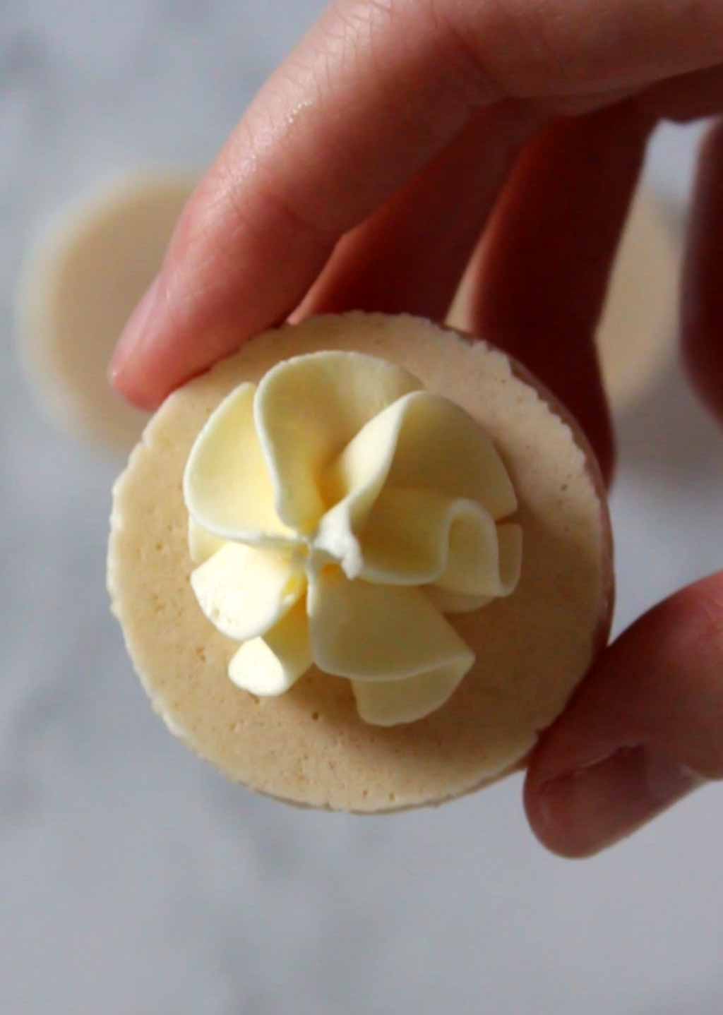 Macaron Shell With Buttercream Swirl Piped Onto It