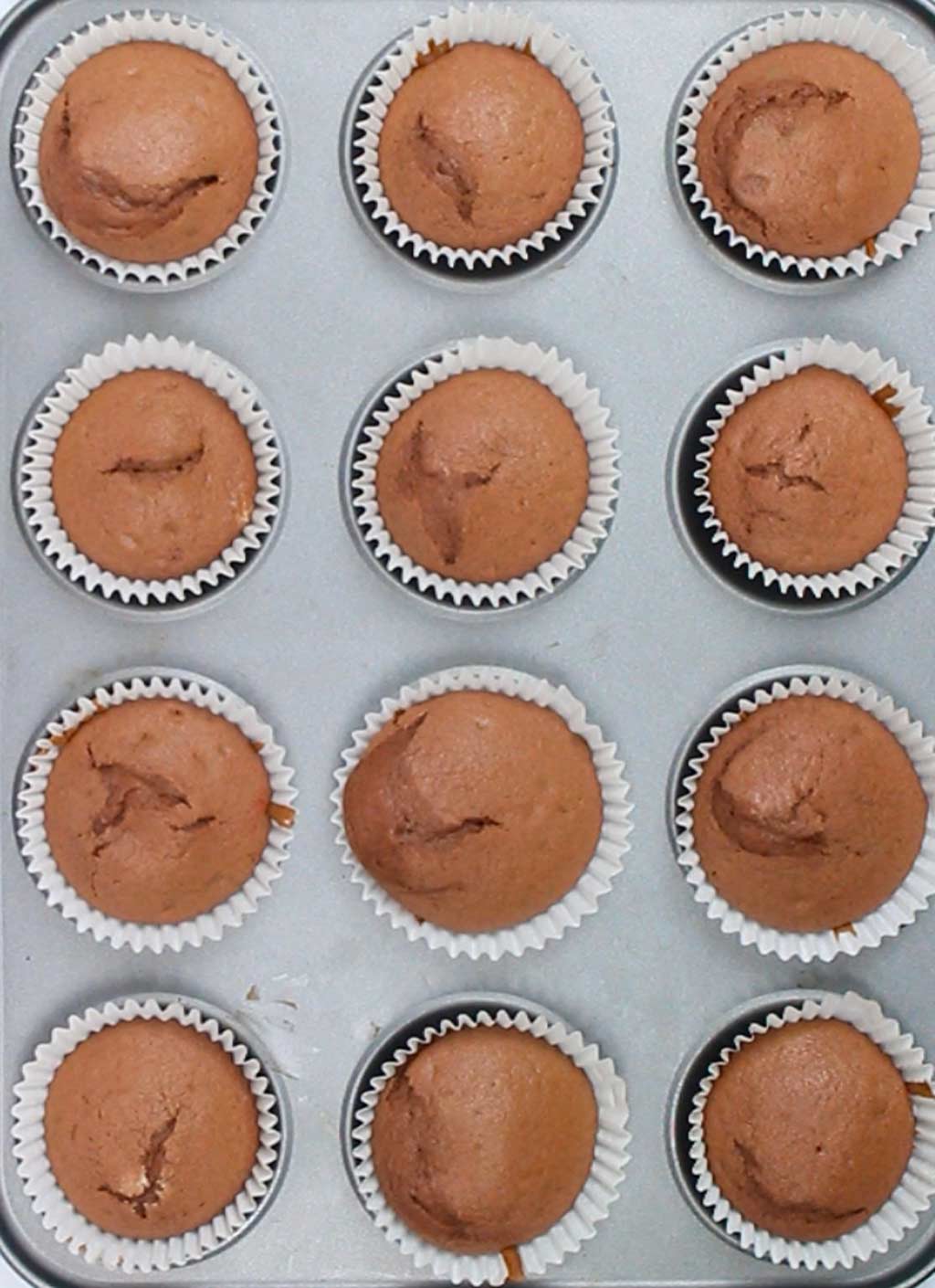 baked red velvet cupcakes in the tray