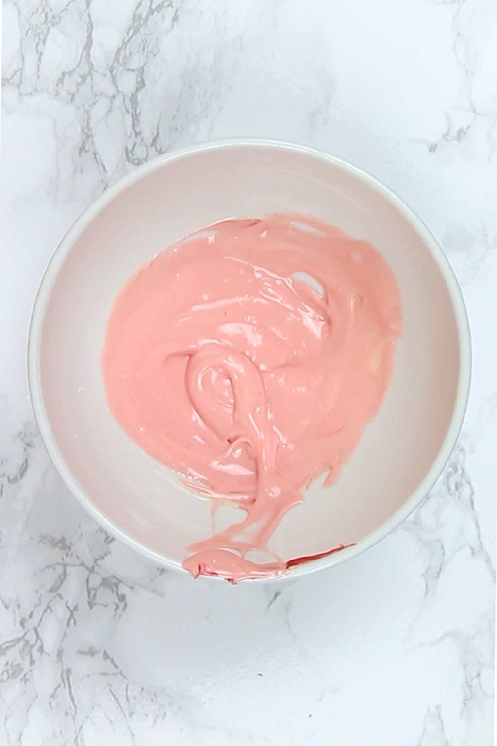 pink melted chocolate in a bowl