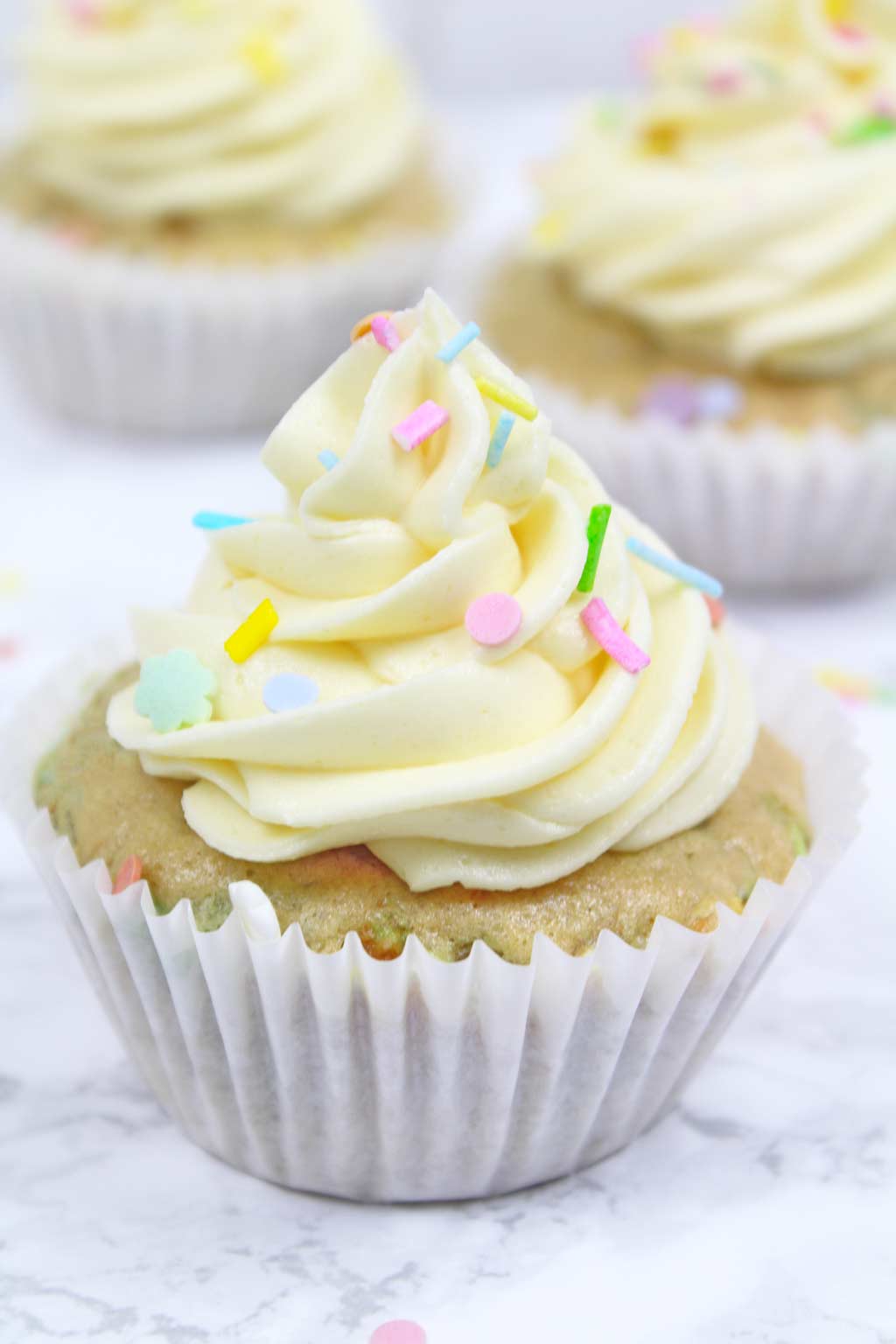 vegan dessert recipes- funfetti cupcake with 2 more in the background
