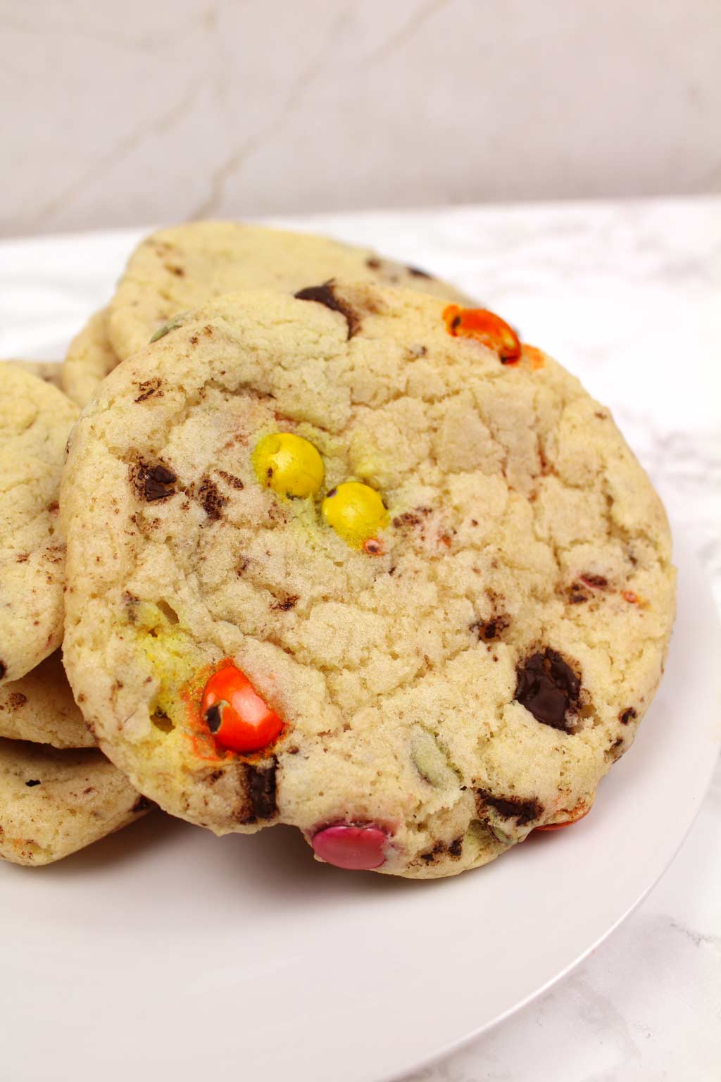 vegan rainbow chip cookie on a plate